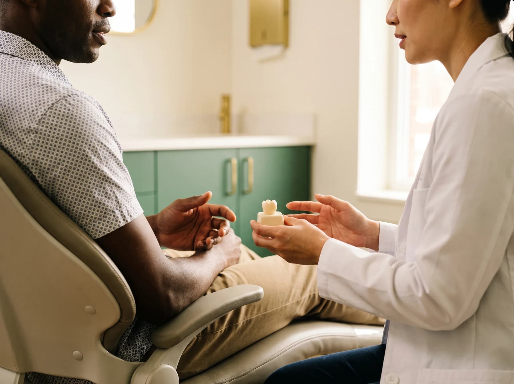 Illustrative dental consultation about planning implant treatment before travel