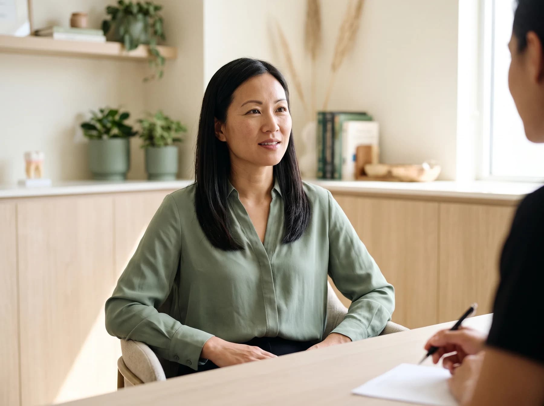 Illustrative portrait of an adult in a calm dental consultation room.