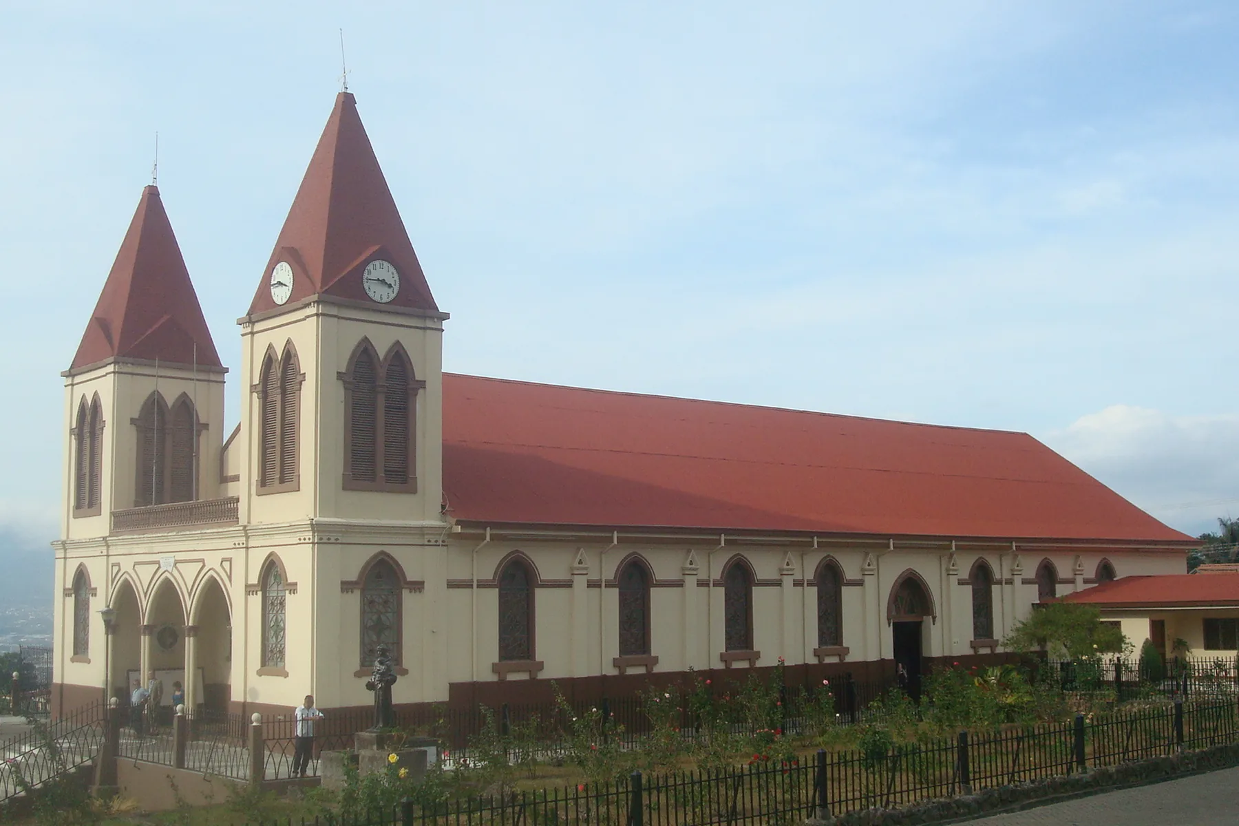 San Antonio de Padua Church with twin red-roofed towers on a hillside in Escazú, Costa Rica.
