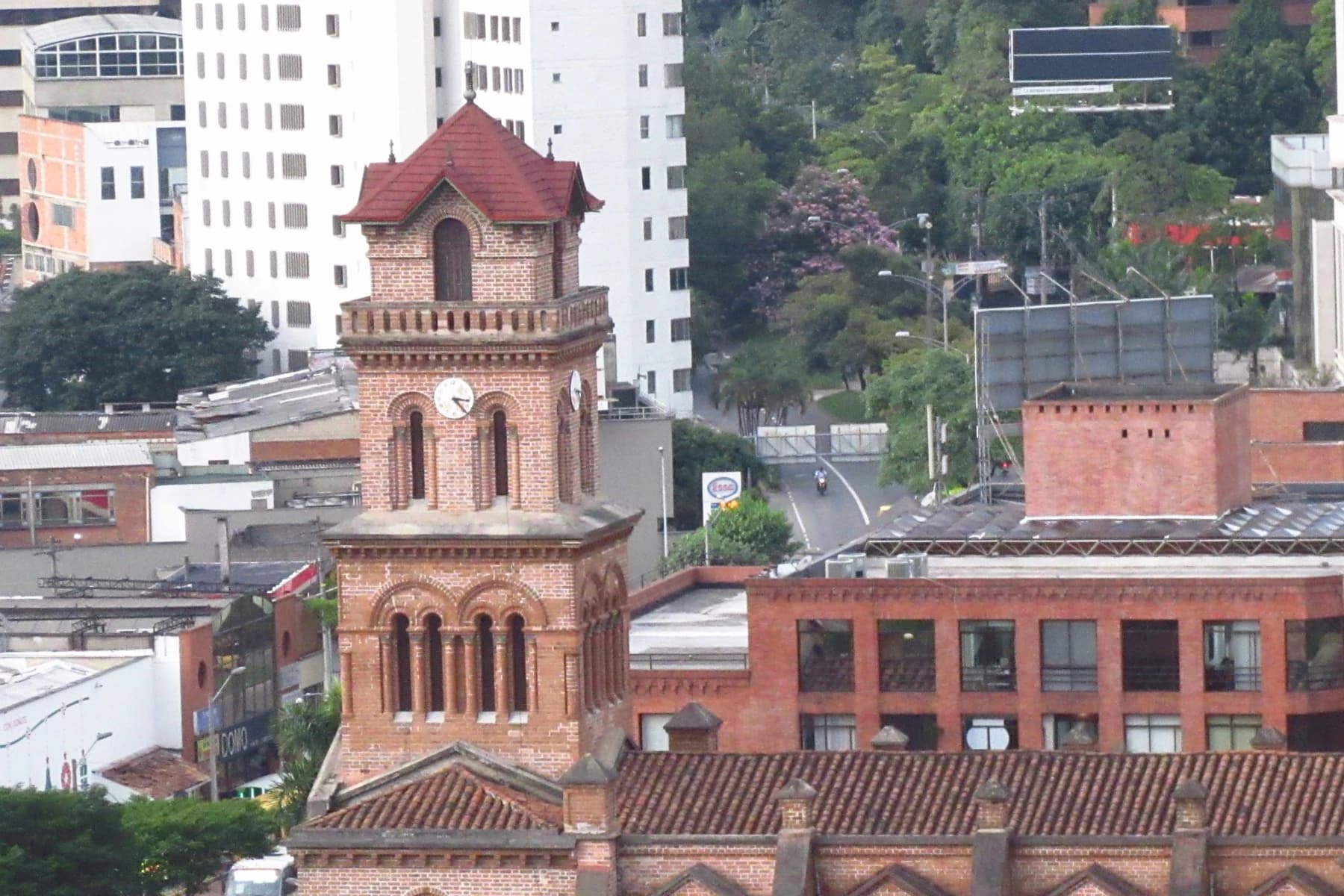 San José del Poblado church among the towers of El Poblado, Medellín.