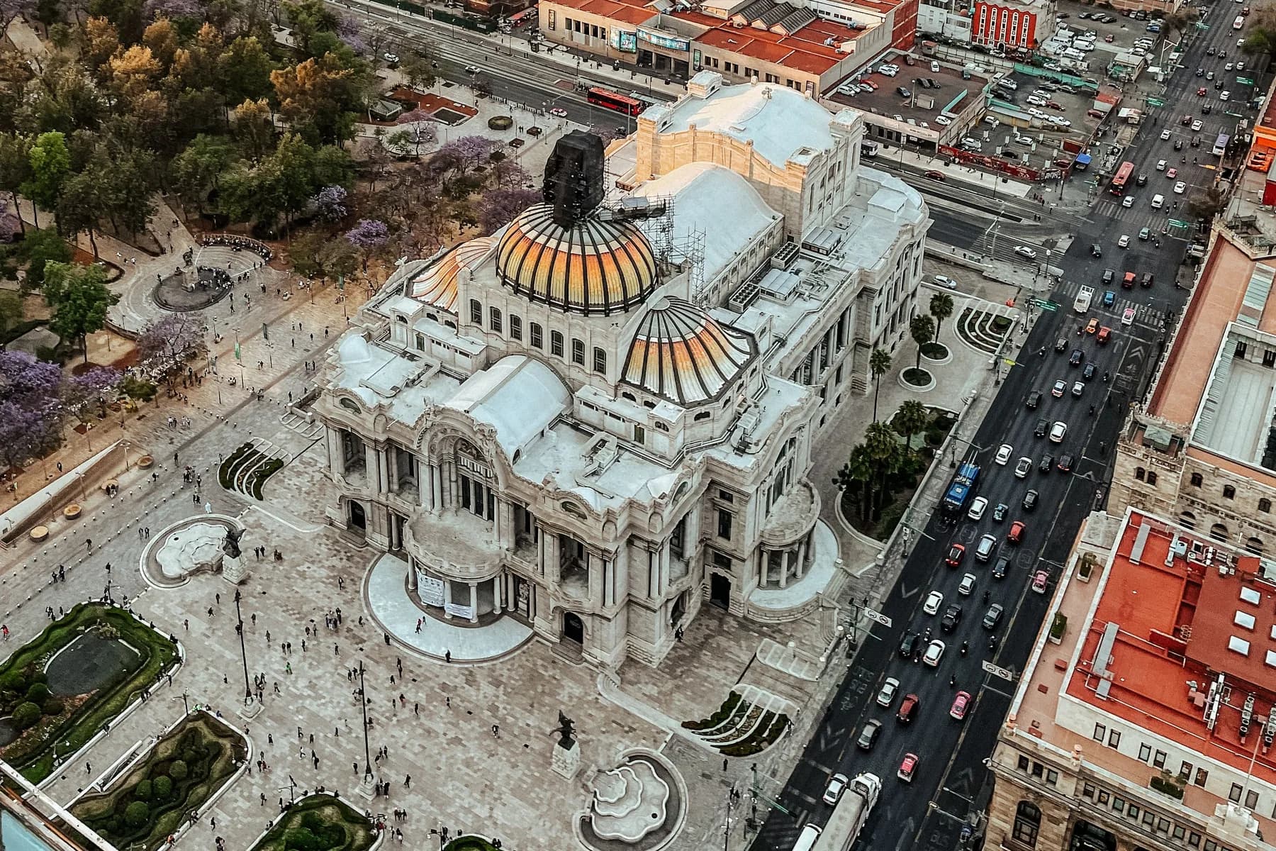 The Palacio de Bellas Artes and its orange dome rise above the historic center of Mexico City.