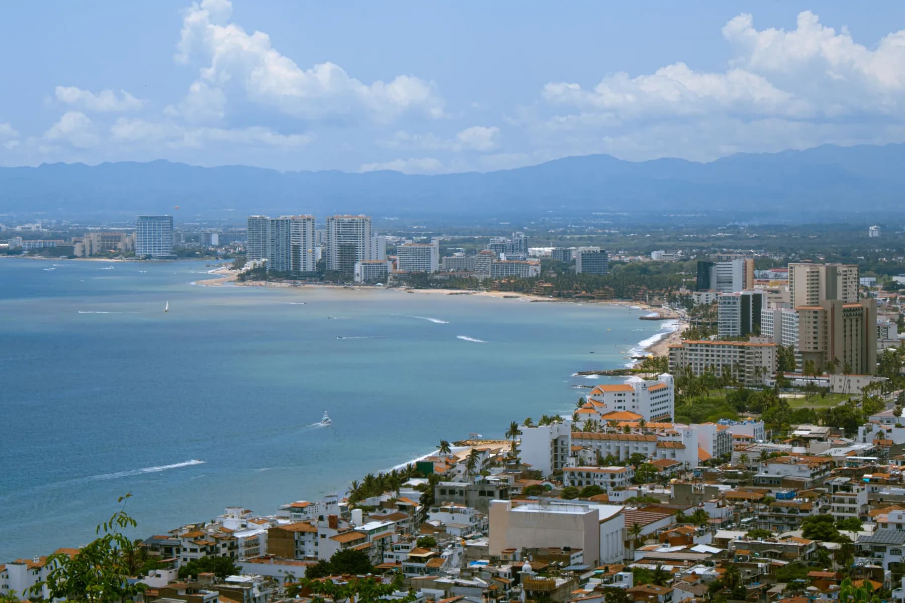 Banderas Bay curves along Puerto Vallarta’s hotel skyline beneath the Sierra Madre mountains in Puerto Vallarta, Mexico.