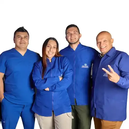 Clínica Colombiana de Implantes Dentales team in blue clinic coats