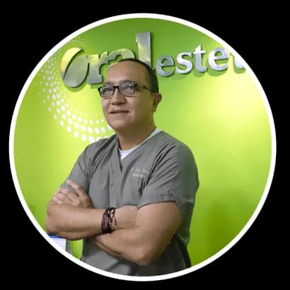 Clinician pictured in front of Oral Estetic branding