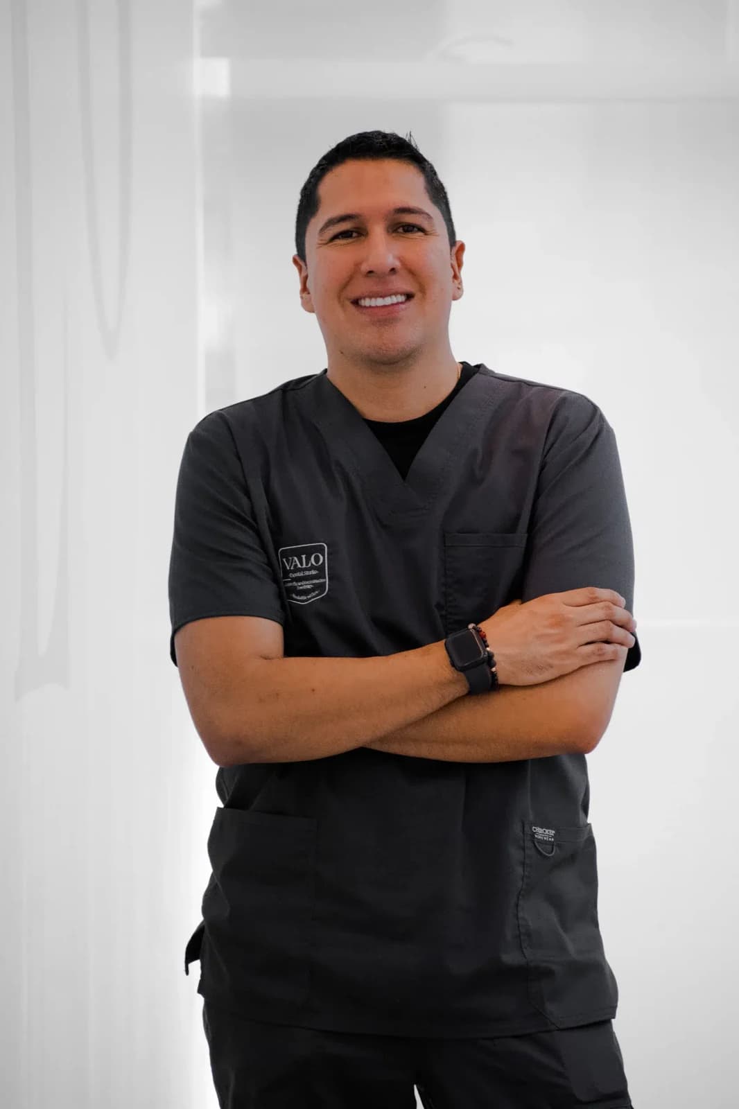 Julian Vasquez wearing Valo Dental Studio clinical scrubs